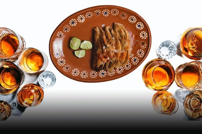 Mexican food plate with limes and drinks