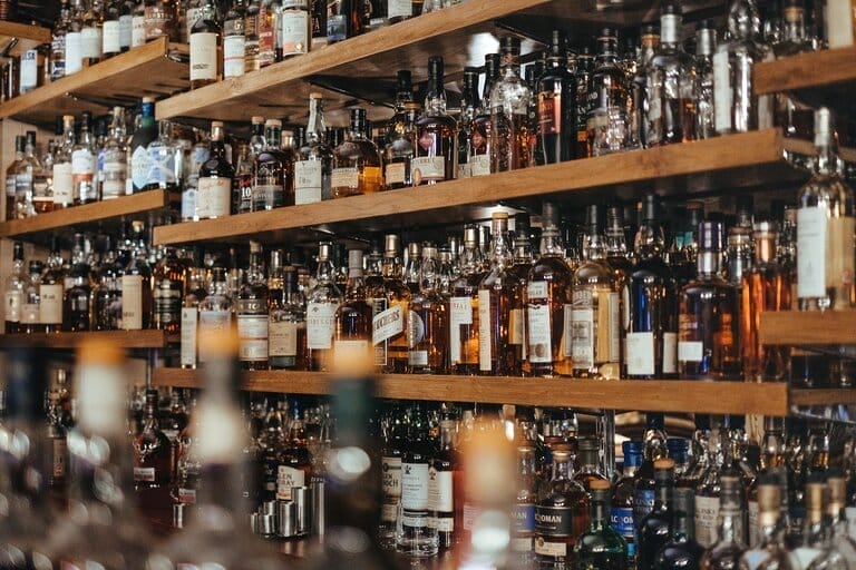 Shelves of liquor bottles in bar