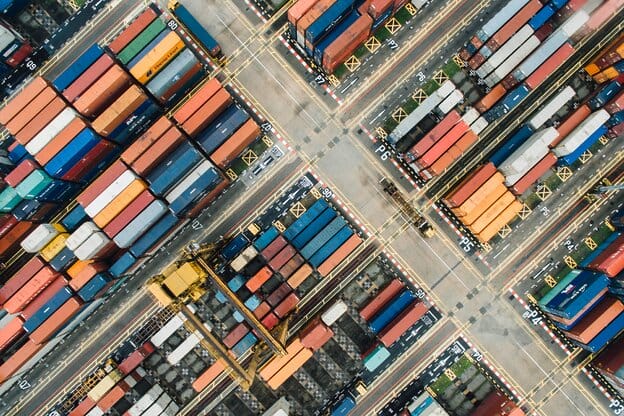 Aerial view of colorful shipping containers at port.