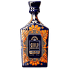 Ornate blue tequila bottle with orange floral design