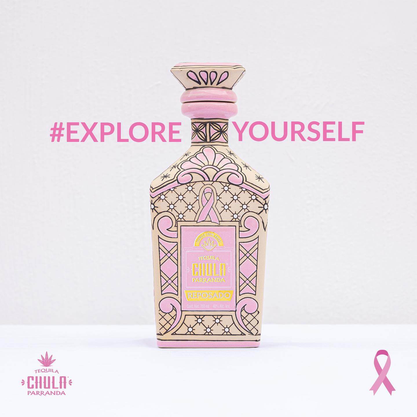 Pink tequila bottle with breast cancer ribbon design